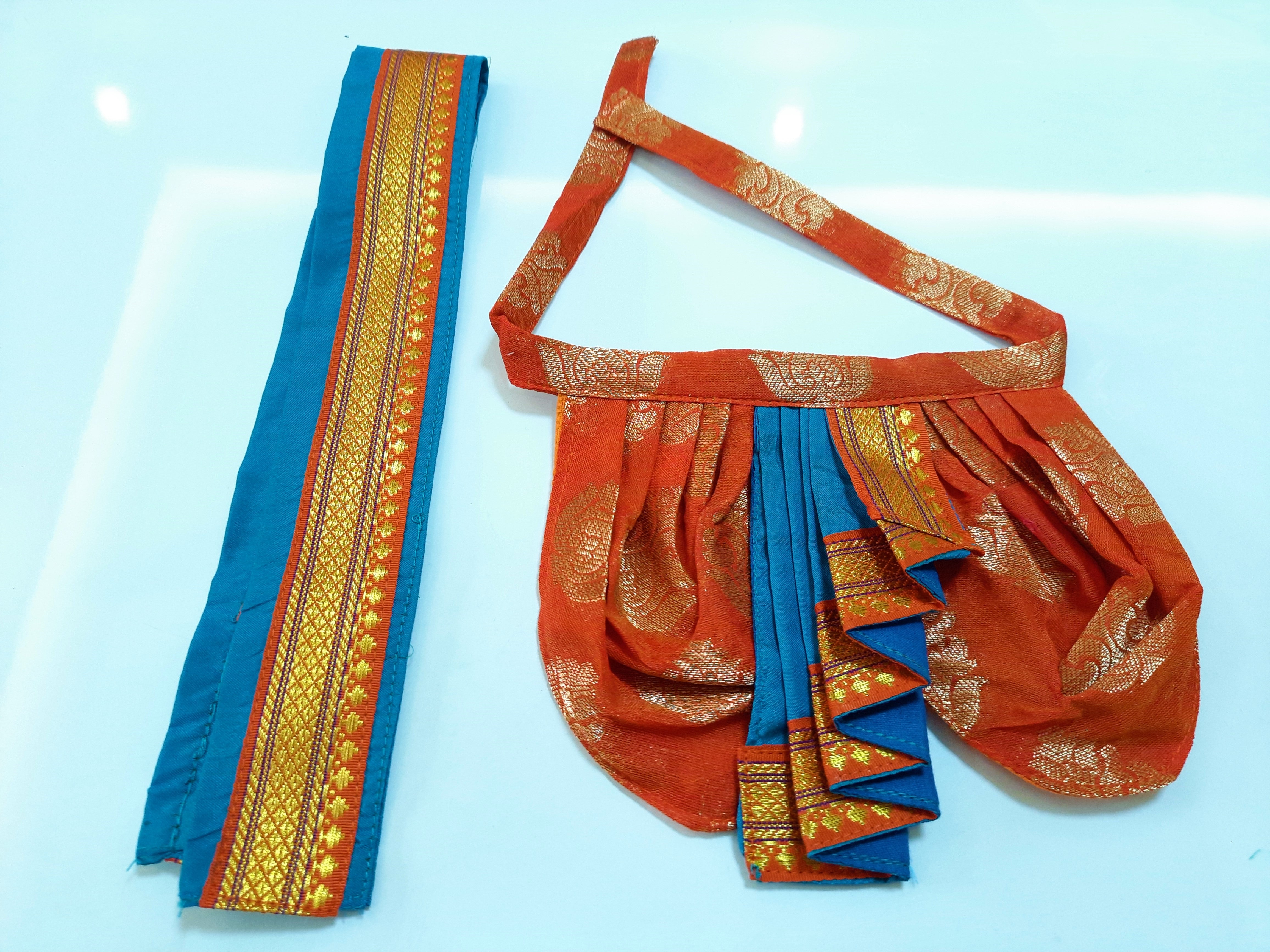 Deity Dhoti and patka shalya / Uparna vastra made of Tapeta Big Butta Silk (Not Pure Silk) - Orange Dhoti with Sky Blue Pleats and Sky Blue Shalya 1