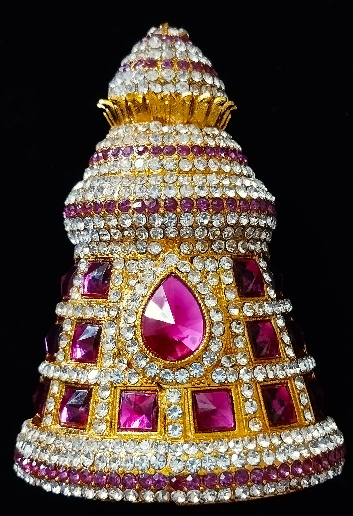 Traditional South Indian Stone-Studded Crown (Kireedam) - Red & White stones / Red, white, & green stones / Pink & White stones/ Pink, white & Green stones on gold plated metal alloy - Length: 3.5 inches, Width: 3.5 inches 1