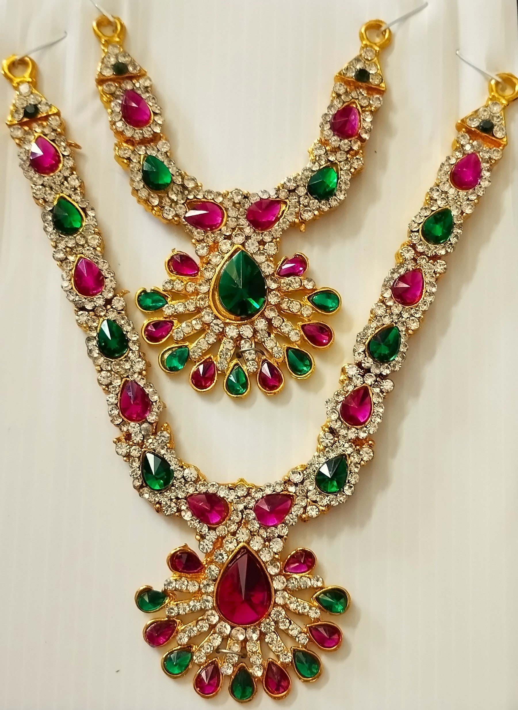Multi-Layer Temple Haram – Royal Grand Alankaram - Red, Green & White stones / Pink, green & white stones on gold plated metal alloy - Length (big): 5.5 inches, Length (Small): 3.5 inches, Width at neck (big): 3.5 inches, Width at neck (small): 2.25 in... 1